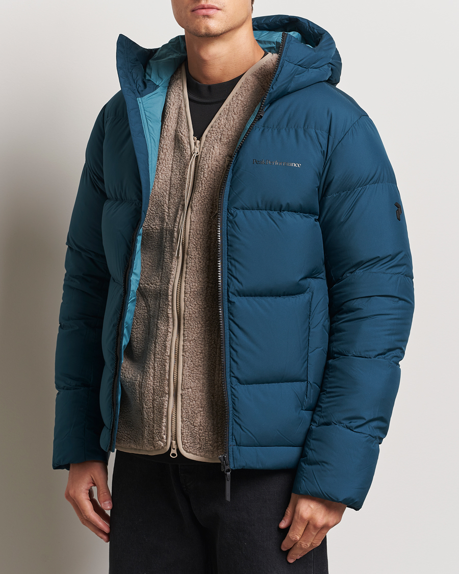 Uomini |  | Peak Performance | Rivel Down Hooded Jacket Ininity Teel